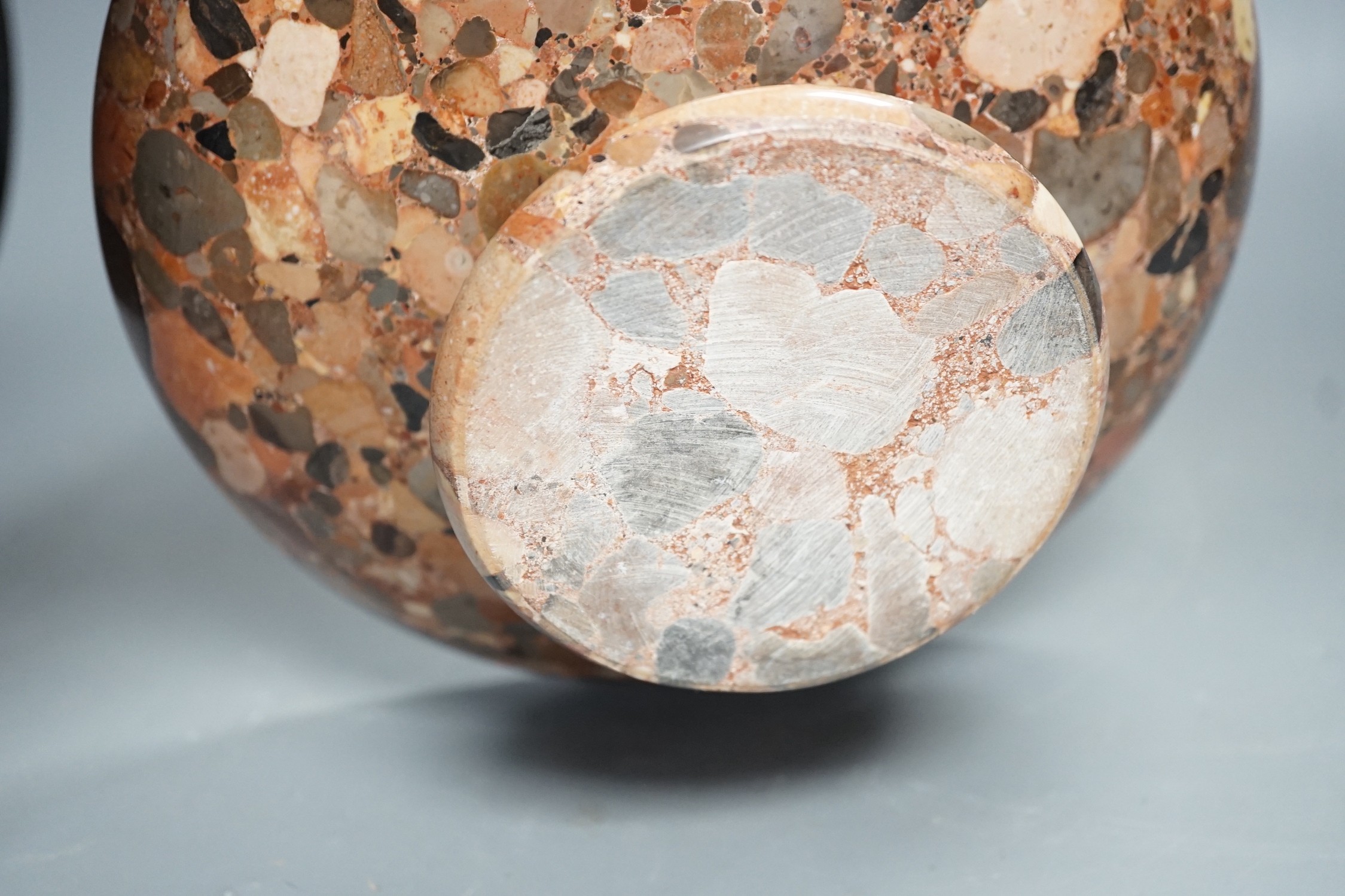 A small polished puddingstone tazza, 23cms diameter